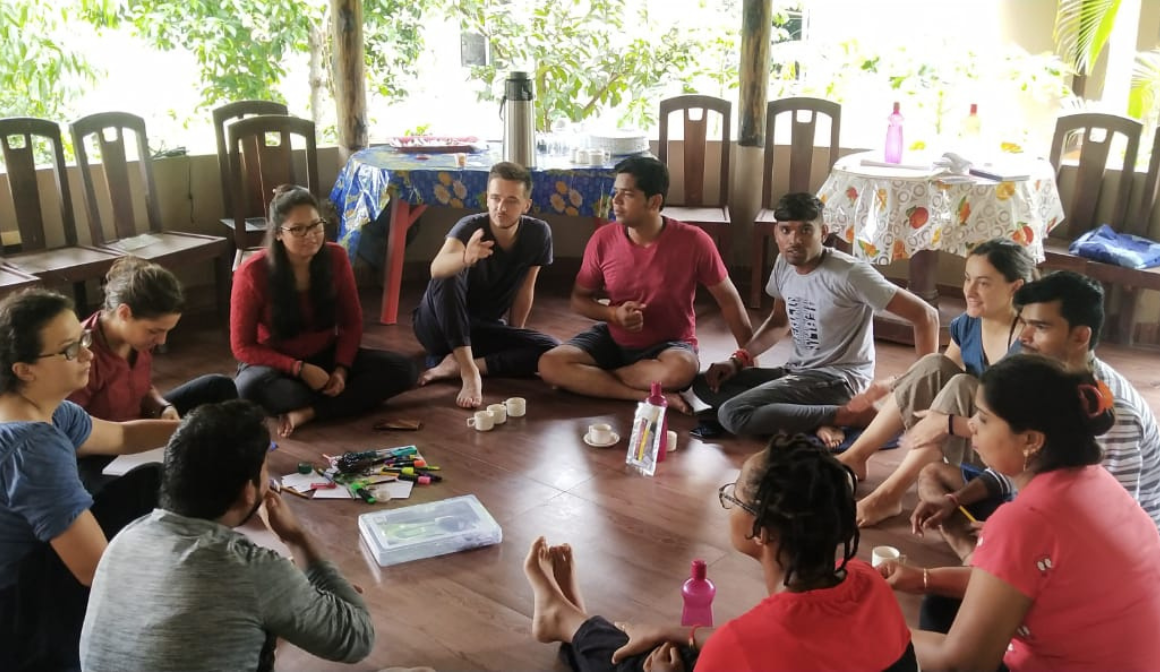 Some People doing some activity setting on the floor